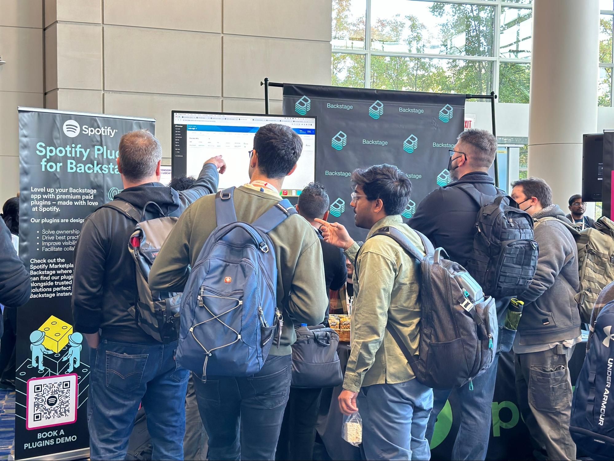 people gathered at a backstagebooth